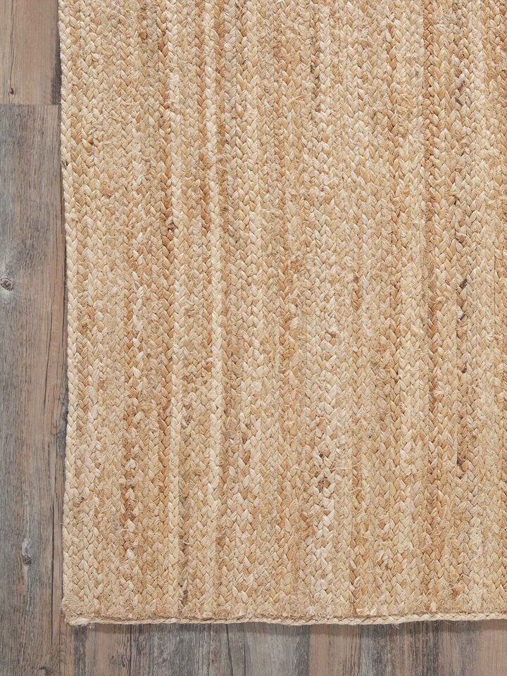 Detailed view of the braided stripe beige Lawan jute natural fibre rug, emphasizing the texture and natural fibres.