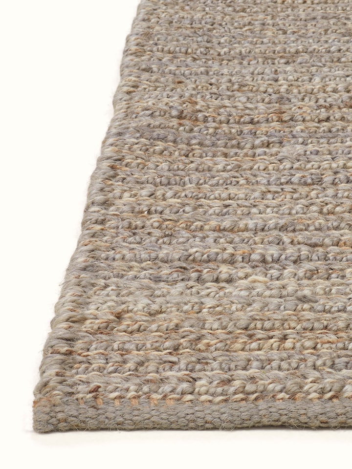 Overhead view of the Textured Solid Grey Jute & Wool Rug, highlighting the rug's texture and design.