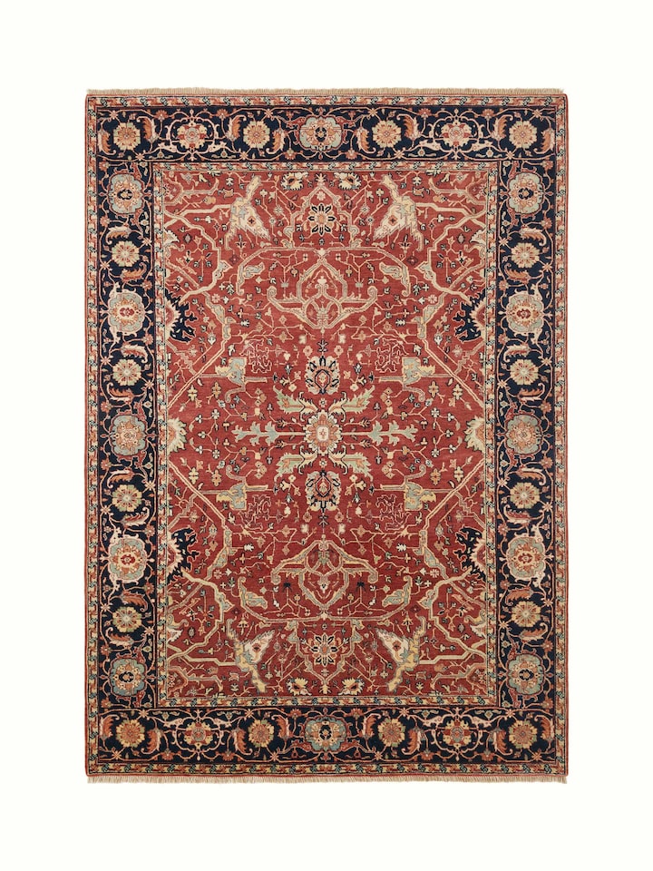 Traditional Heriz red Bhadohi wool hand-knotted rug, showcasing the intricate patterns and rich red color.