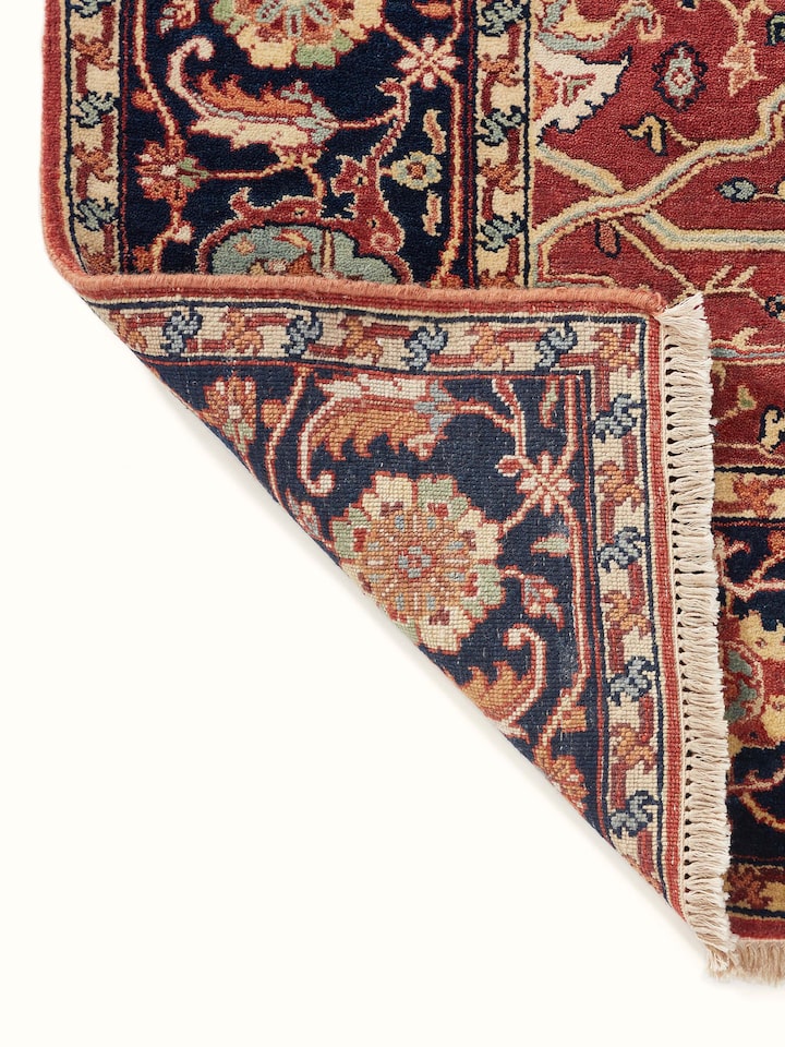 Traditional Heriz red Bhadohi wool hand-knotted rug, highlighting the overall design and craftsmanship of the rug.