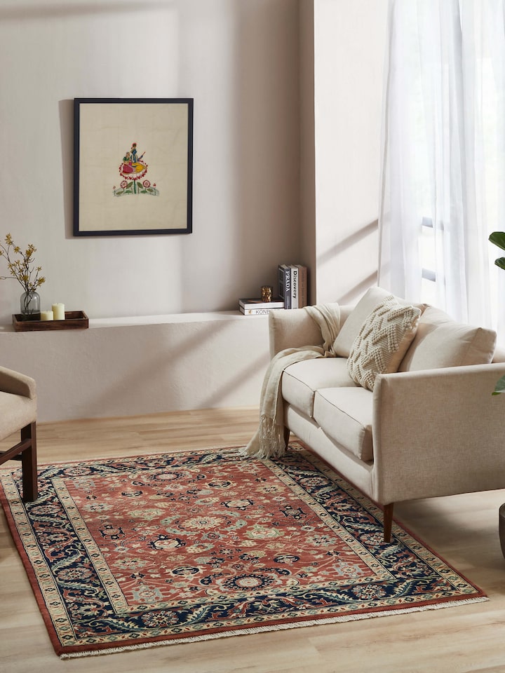 Styled view of Traditional Guldasta Rust Bhadohi Wool Hand-knotted Rug styled in a room setting