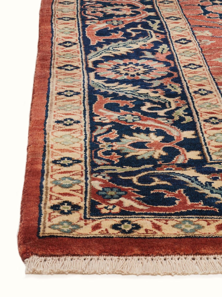 Close-up view of Traditional Guldasta Rust Bhadohi Wool Hand-knotted Rug highlighting the hand-knotted weave and motif detail