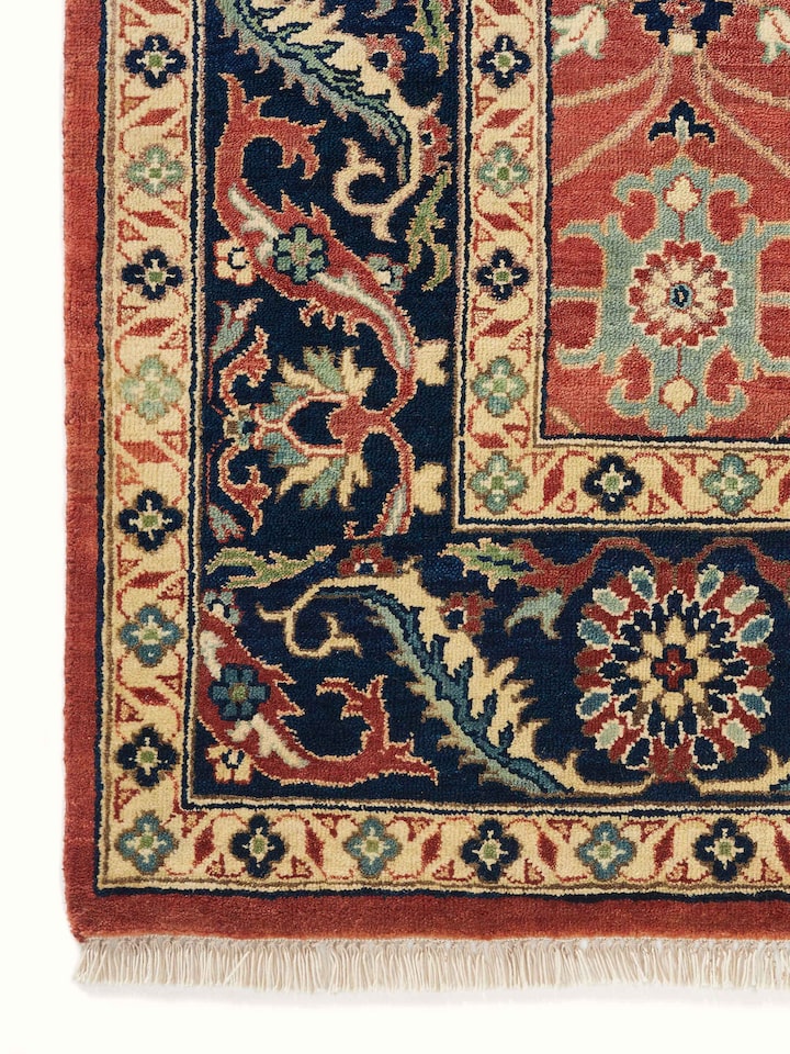 Detail view of Traditional Guldasta Rust Bhadohi Wool Hand-knotted Rug highlighting the intricate pattern and pile texture, from a different angle