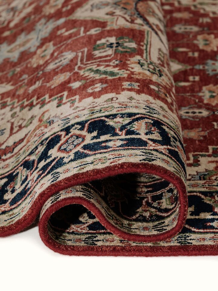 Close-up view of Traditional Heriz rust Bhadohi wool hand-knotted rug emphasizing texture and weave