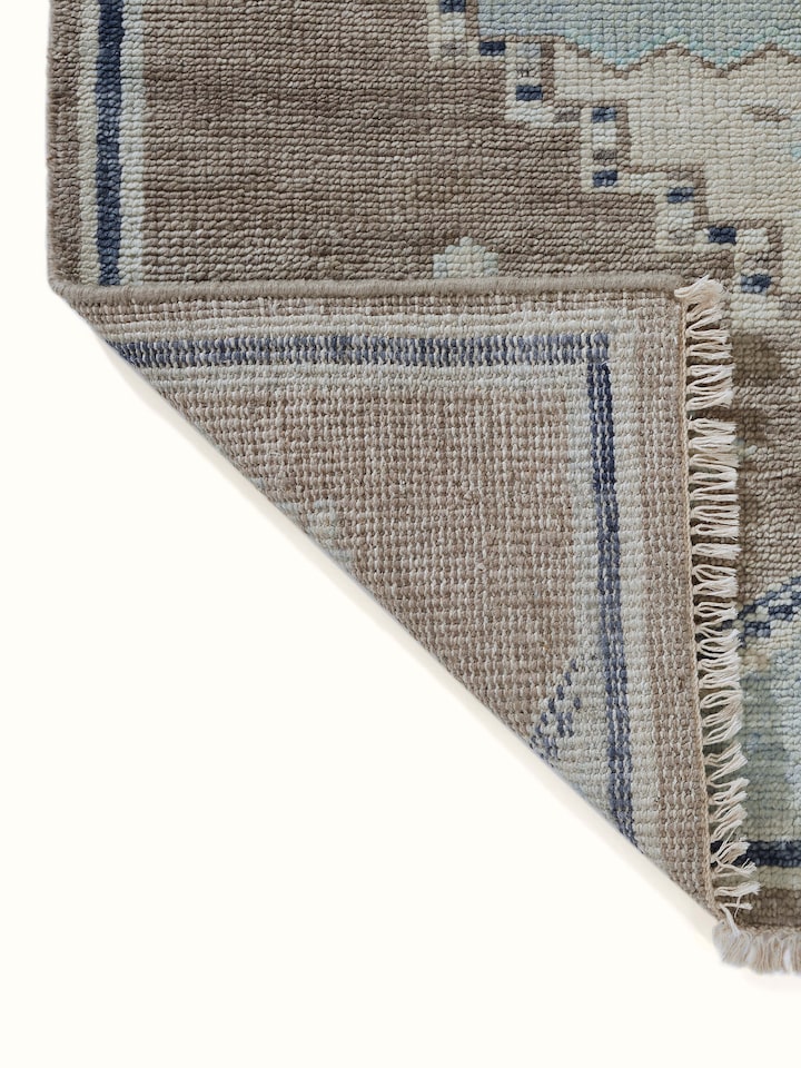 Traditional Oushak Grey Blue Bhadohi Wool Hand-Knotted Rug, highlighting its elegant border and overall aesthetic.