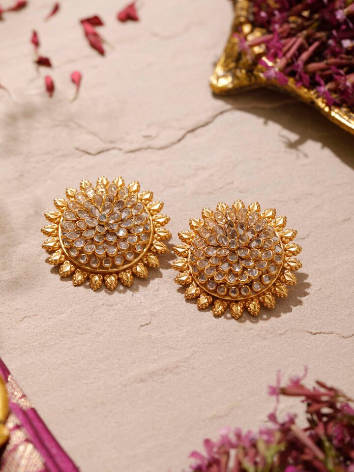 Angled view of silver smithing stud earrings showcasing their refined design and polished finish