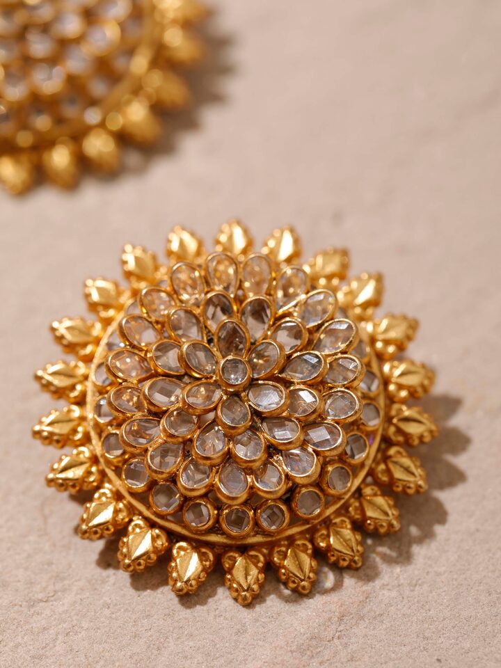 Detailed close-up of silver smithing stud earrings emphasizing their smooth finish and fine craftsmanship