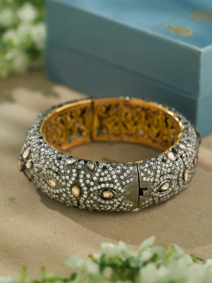 Close-up view of Silversmithing Bangle highlighting the stone setting and metalwork detail