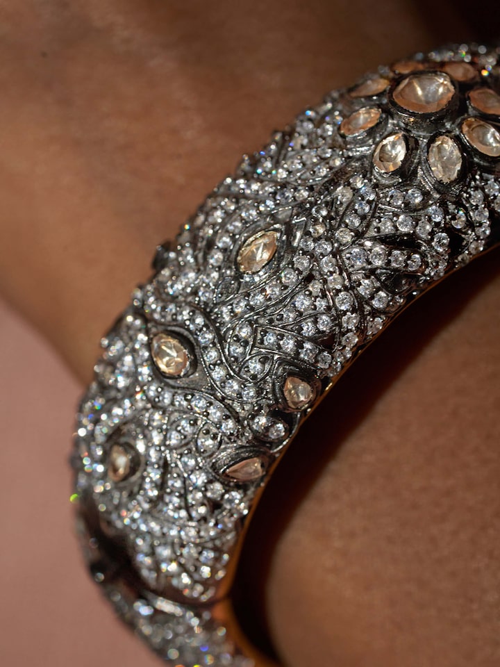 Detail view of Silversmithing Bangle highlighting the stone setting and metalwork detail, from a different angle