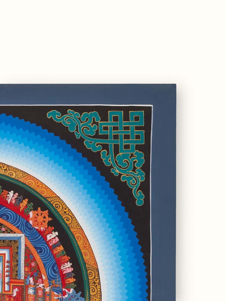 Side view of Thangka mandala painting, showcasing its elaborate design and traditional color palette.