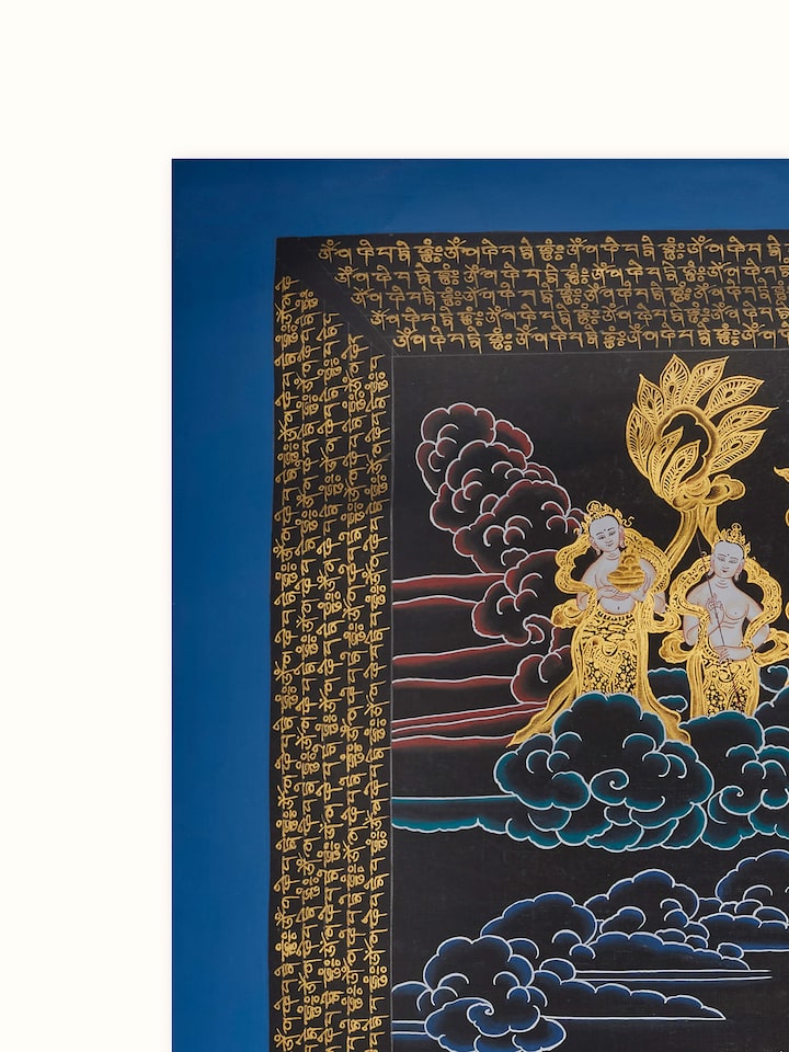 Close-up of Thangka Compassion Buddha painting, highlighting the fine details and artistic elements.