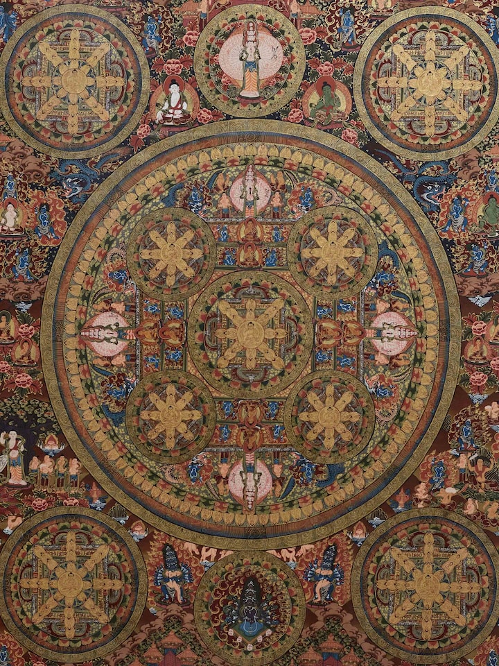 Close-up of Thangka mandala painting highlighting detailed mandala patterns and colors.