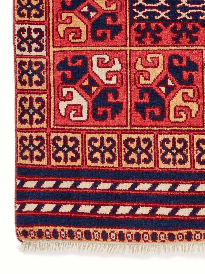 Top view of Kazak tribal red Agra wool hand-knotted rug (6x9 ft), showcasing the full design and layout.