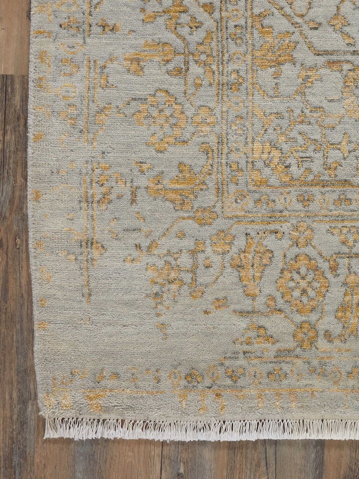 Detailed view of the distressed transitional grey Agra wool & viscose hand-knotted rug, showing its texture and color variation