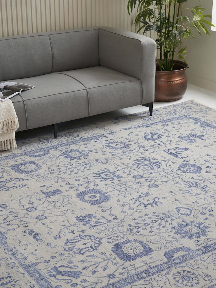 Room scene of Agra Grey Blue Rug showing textured transitional pattern with worn vintage effect.