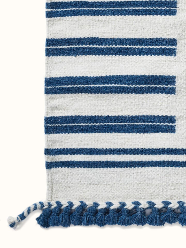Geo border ivory blue Gujarat wool & cotton panja dhurrie kharad (4x6 ft) displayed to show its full pattern and texture.
