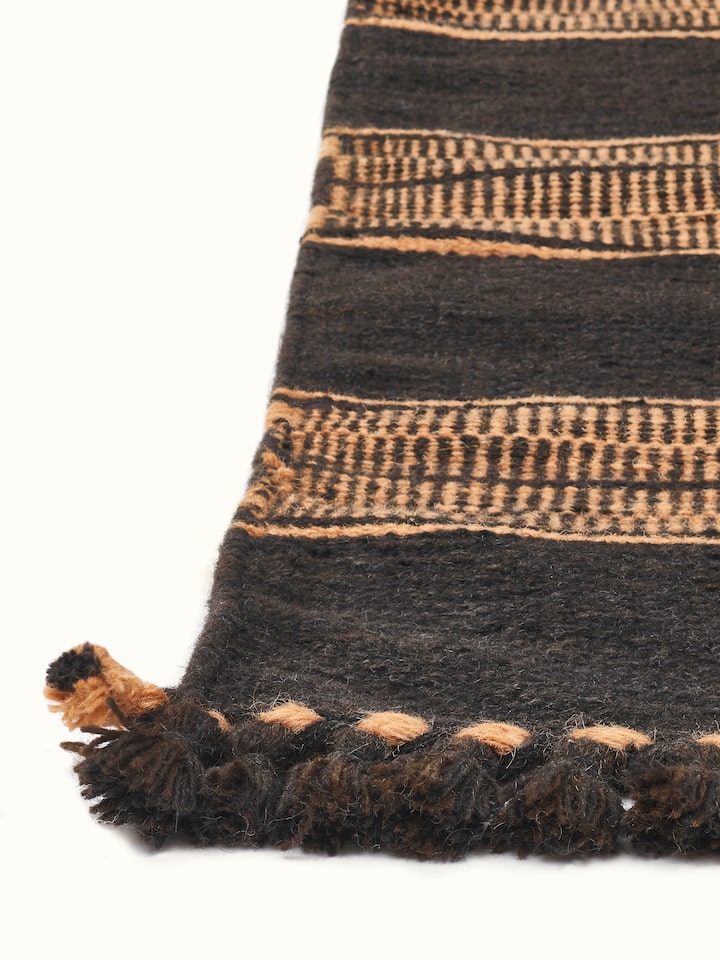 Detailed view of Geo Diamonds Dark Brown Gujarat Wool & Cotton Panja Dhurrie Kharad (4x6 ft), showing the texture and pattern in use.