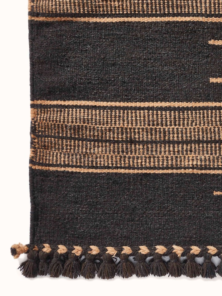 Angled view of Geo Diamonds Dark Brown Gujarat Wool & Cotton Panja Dhurrie Kharad (4x6 ft), displaying the full design and its placement.