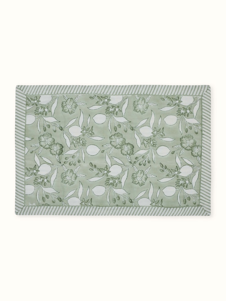 Front view of set of six green floral hand block printed cotton linen table mats.