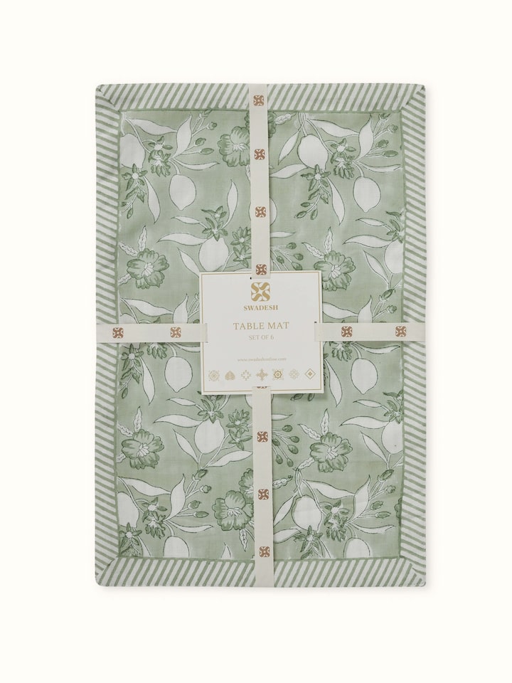Side view showing complete mat set with green floral Sanganeri patterns.