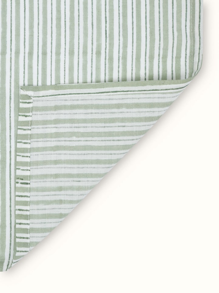 Angled view of Anika Green Stripe Cotton Linen Sanganeri Block Printed Dinner Napkins, showcasing the napkins' design and pattern.