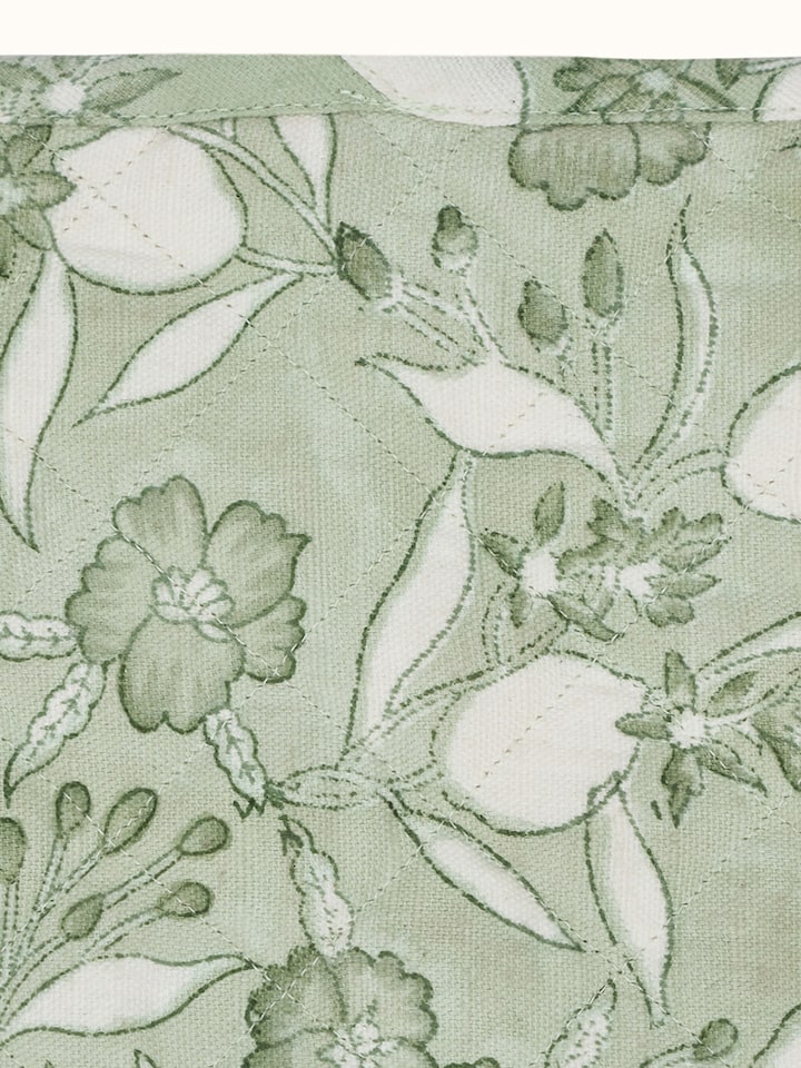 Detailed view of Anika green floral cotton Sanganeri block printed pot holder showing the intricate floral pattern and cotton texture.