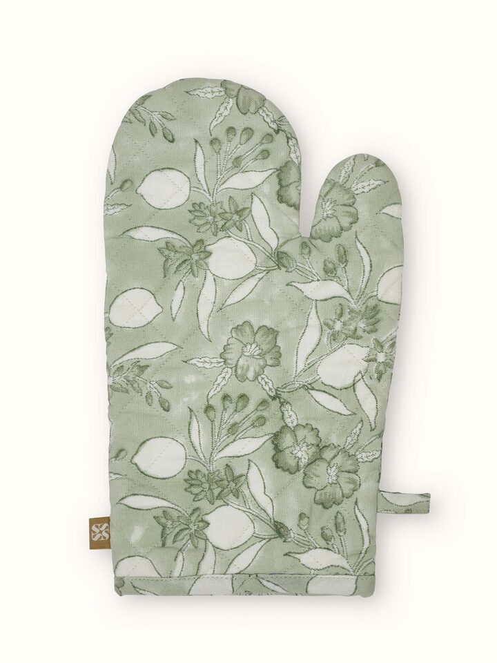 Green floral cotton Sanganeri block printed oven mitts with vibrant floral patterns.