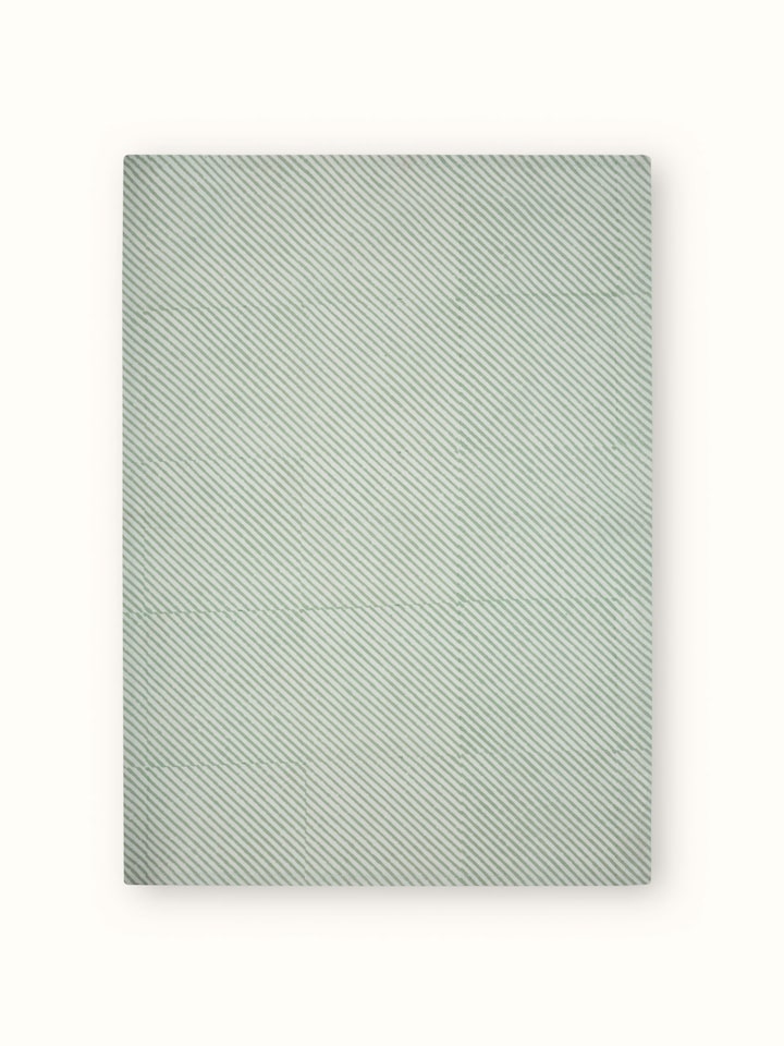 Side view of Anika green floral cotton Sanganeri block printed dish towel showing the texture and print pattern.