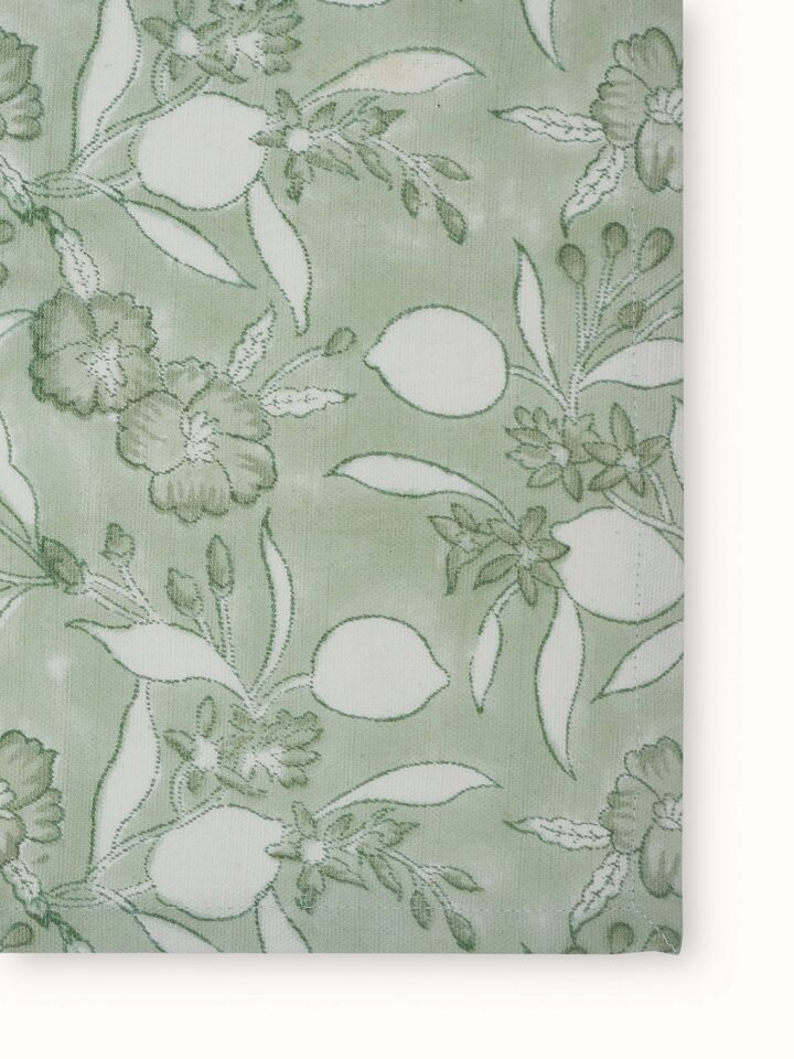Detailed view of Anika green floral cotton Sanganeri block printed dish towel featuring the block print pattern.