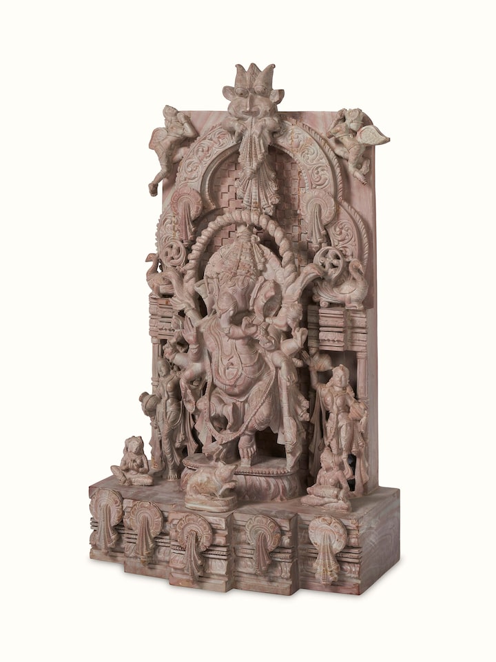 Side view of Stone Ganesha idol highlighting the idol's detailed carving