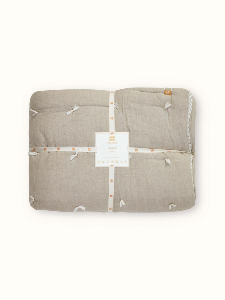 Detailed view of Anuthi Beige Solid Linen Razai Embroidered Double Quilt, focusing on the intricate embroidery and fabric quality.