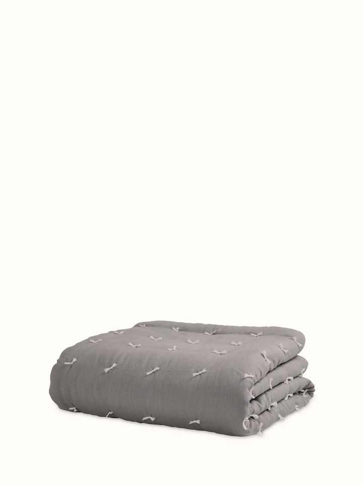 Full view of Anuthi grey solid linen razai embroidered double quilt highlighting the quilt's size and design