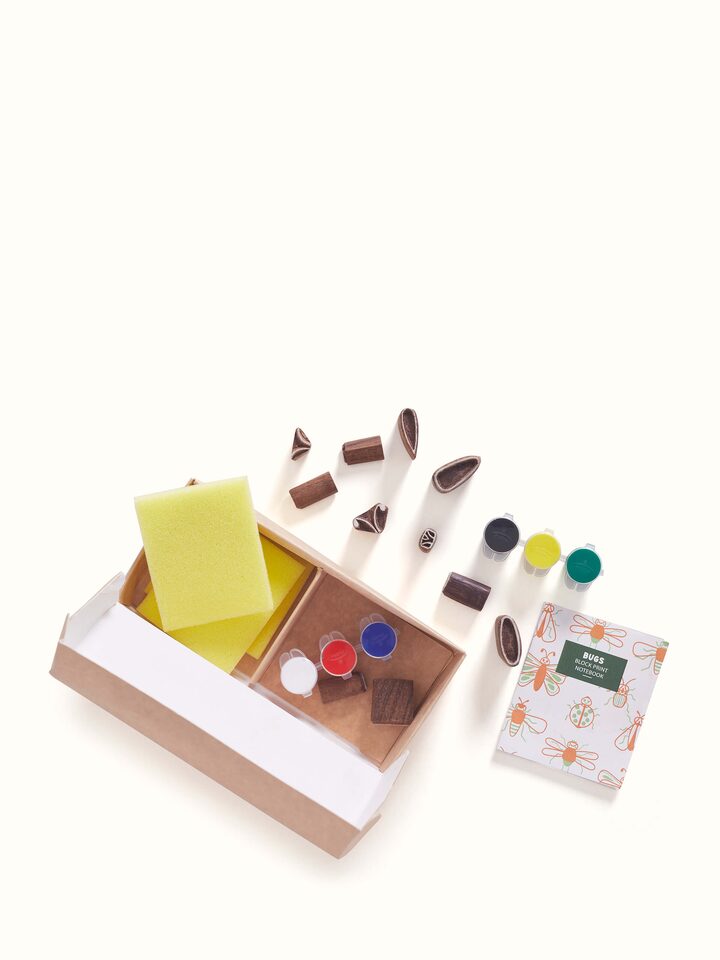 Close-up view of Block painting DIY kit with white bugs design, focusing on the intricate patterns and quality materials