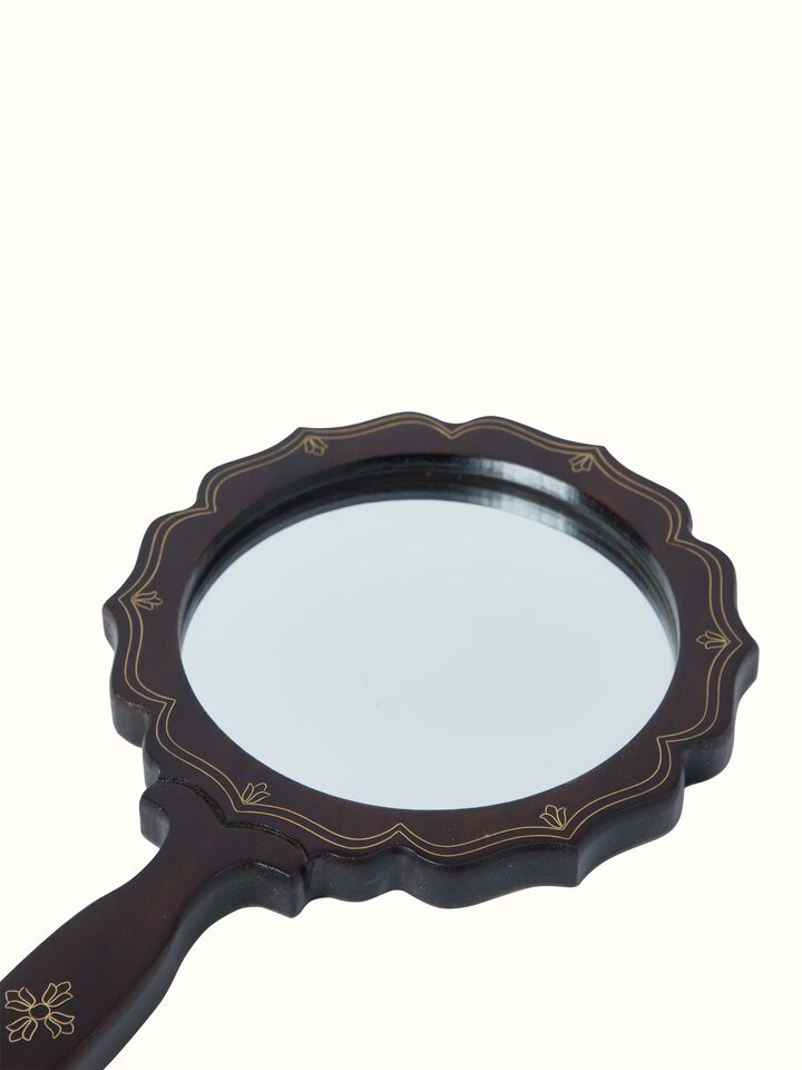 Detailed view of Tarkashi sheesham wood & brass inlaid mirror in brown color, highlighting the elegant wood and brass details.