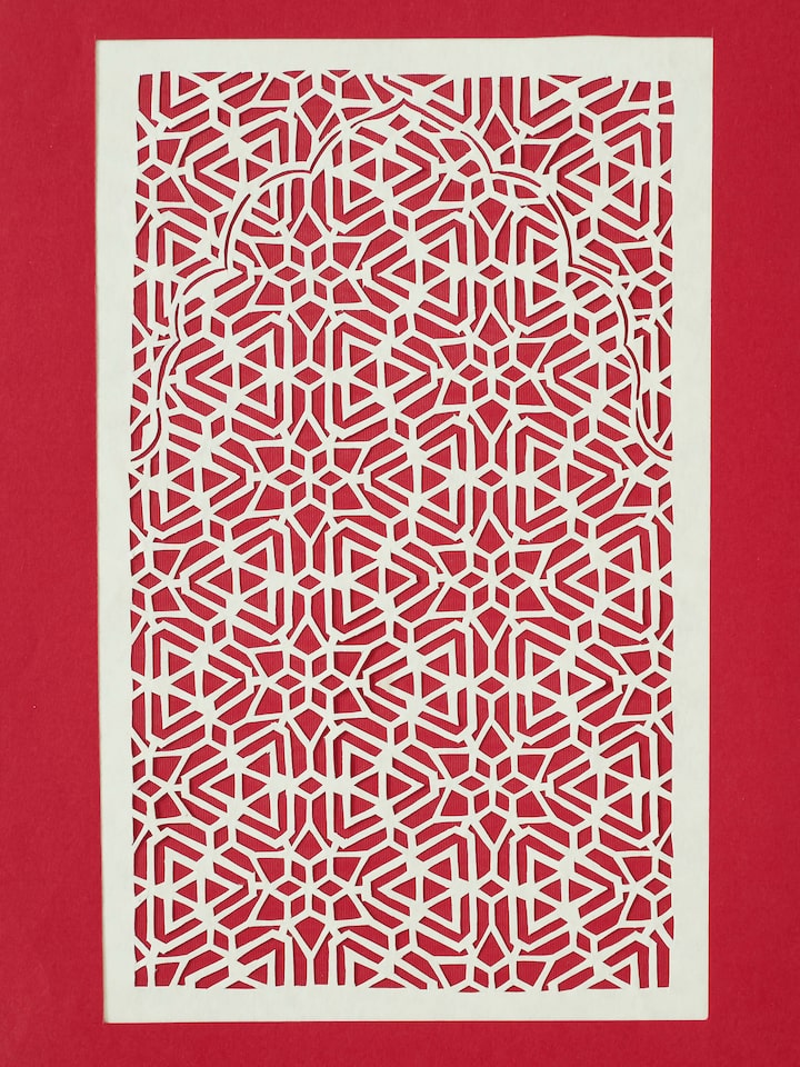 Side view of Sanjhi Paper Stencil Kata Jaali Wall Art, showing the depth and texture of the paper stencil design