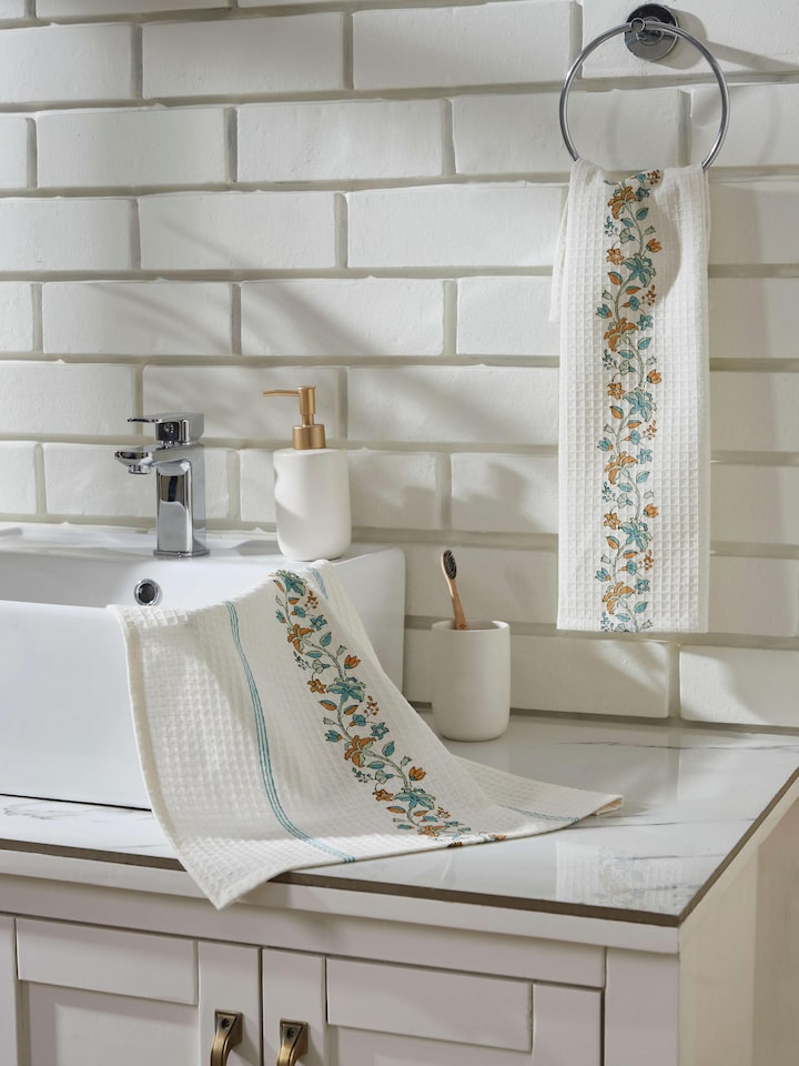 Side view of Palampore border white floral cotton Sanganeri block printed hand towels (2 pcs) showcasing the floral block print and border