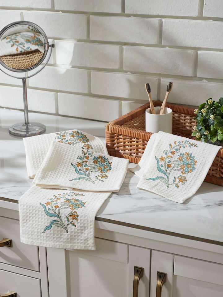 Close-up of Palampore white floral cotton face towel featuring Sanganeri block print and detailed floral patterns.