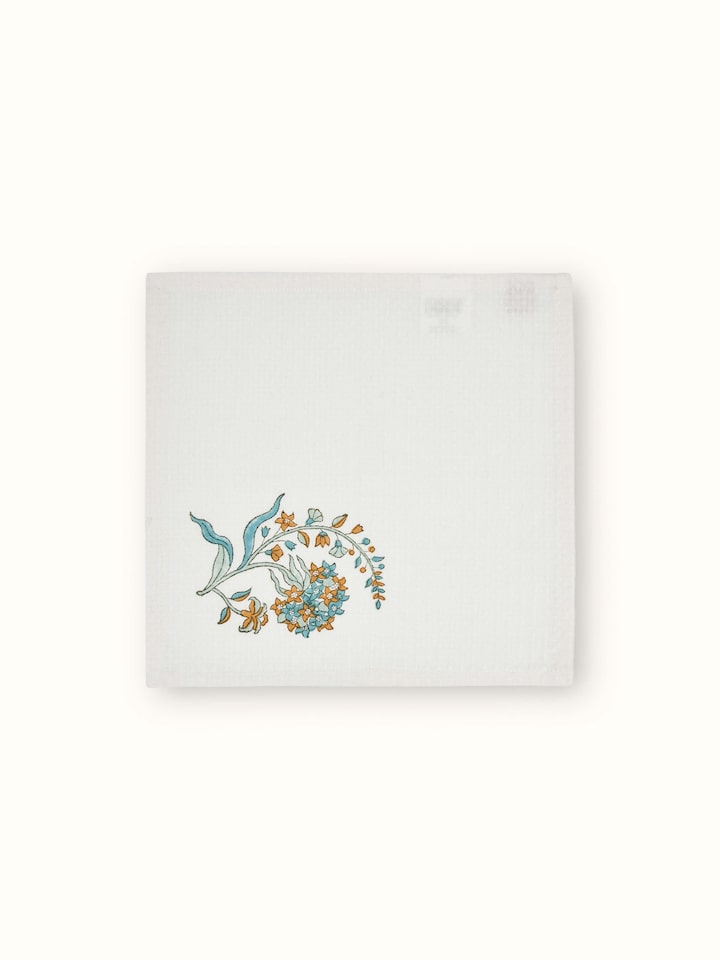Full view of Palampore white floral cotton face towels arranged to show the Sanganeri block print and overall design.