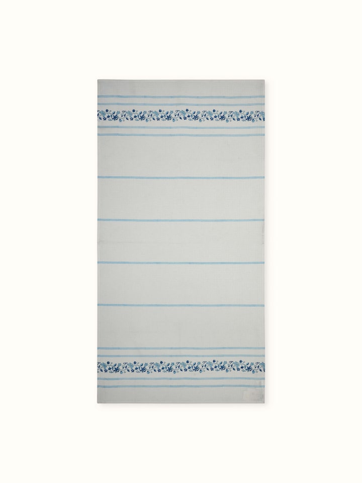 Full view of Palampore blue floral cotton bath towel with Sanganeri block print and stripe design