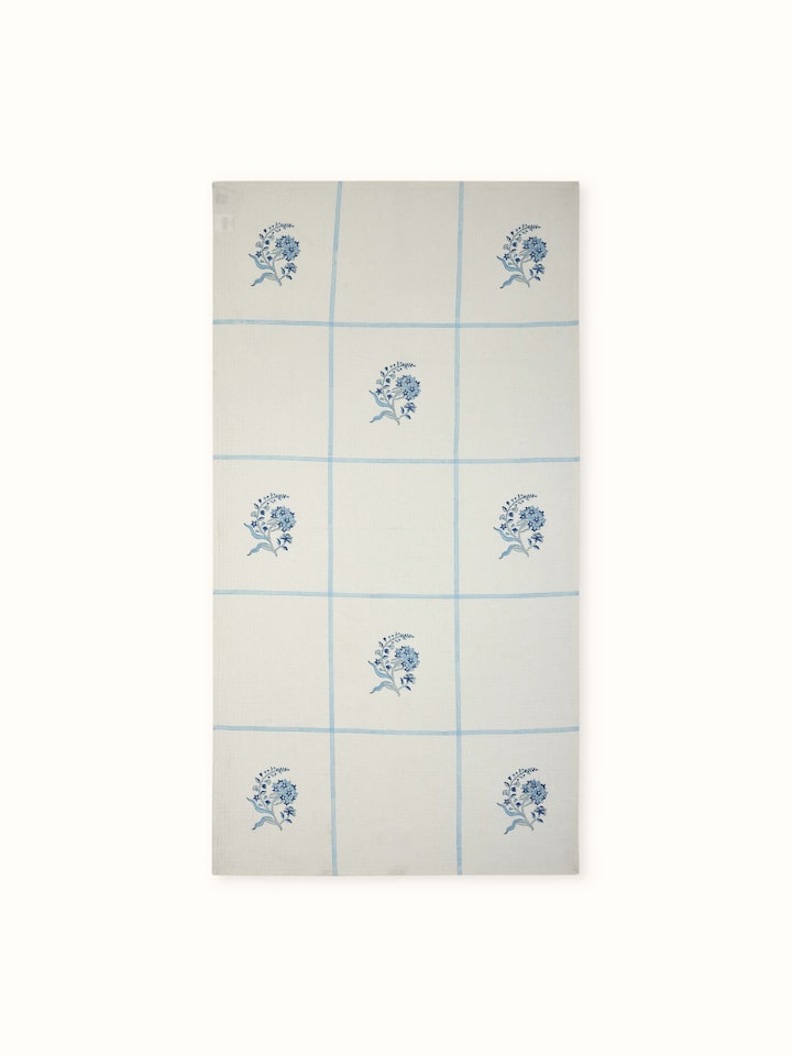 Full view of Palampore Buta blue floral cotton Sanganeri block printed bath towel (L) showcasing its vibrant floral Sanganeri block print and soft cotton fabric.