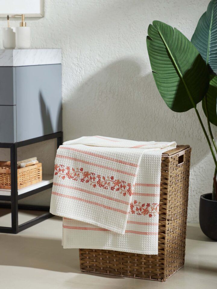 Close-up of Palampore Stripe Peach Floral Cotton Sanganeri Block Printed Bath Towel (L) focusing on the block print details and colors.