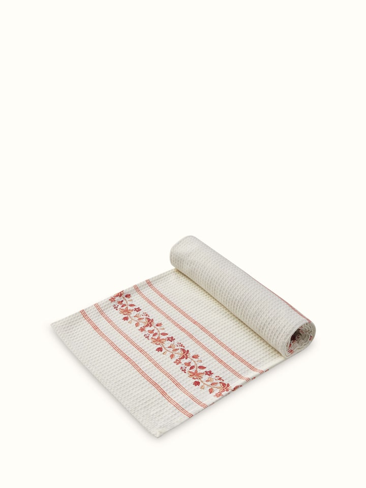 Side view of Palampore Stripe Peach Floral Cotton Sanganeri Block Printed Bath Towel (L) highlighting the towel’s texture and design.