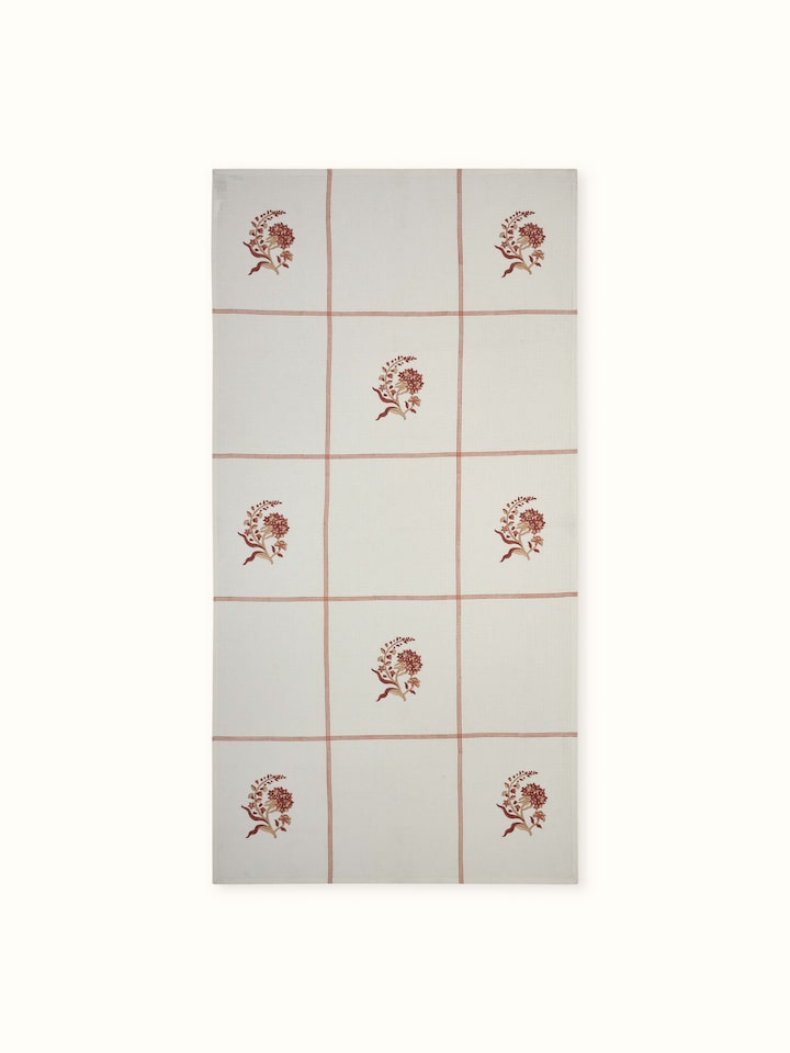 Full view of Palampore buta peach floral cotton Sanganeri block printed bath towel (L) featuring its vibrant peach floral design and block print pattern.