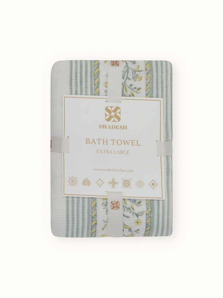 Detailed view of Ambi border yellow floral cotton Sanganeri block printed bath towel (XL) focusing on the fabric texture and floral design.