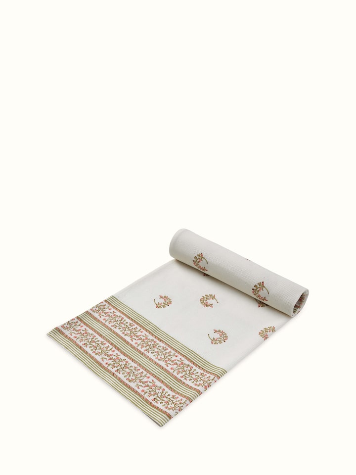 Close-up view of Ambi allover peach floral cotton Sanganeri block printed bath towel (L), focusing on the block print details.