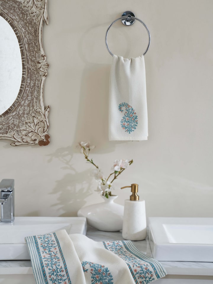 Full view of Ambi stripe blue floral cotton hand towel showing the Sanganeri block print design and texture.