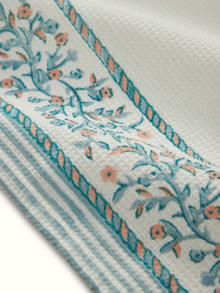 Ambi stripe blue floral cotton hand towel in a grouped arrangement, showcasing the Sanganeri block print on multiple towels.
