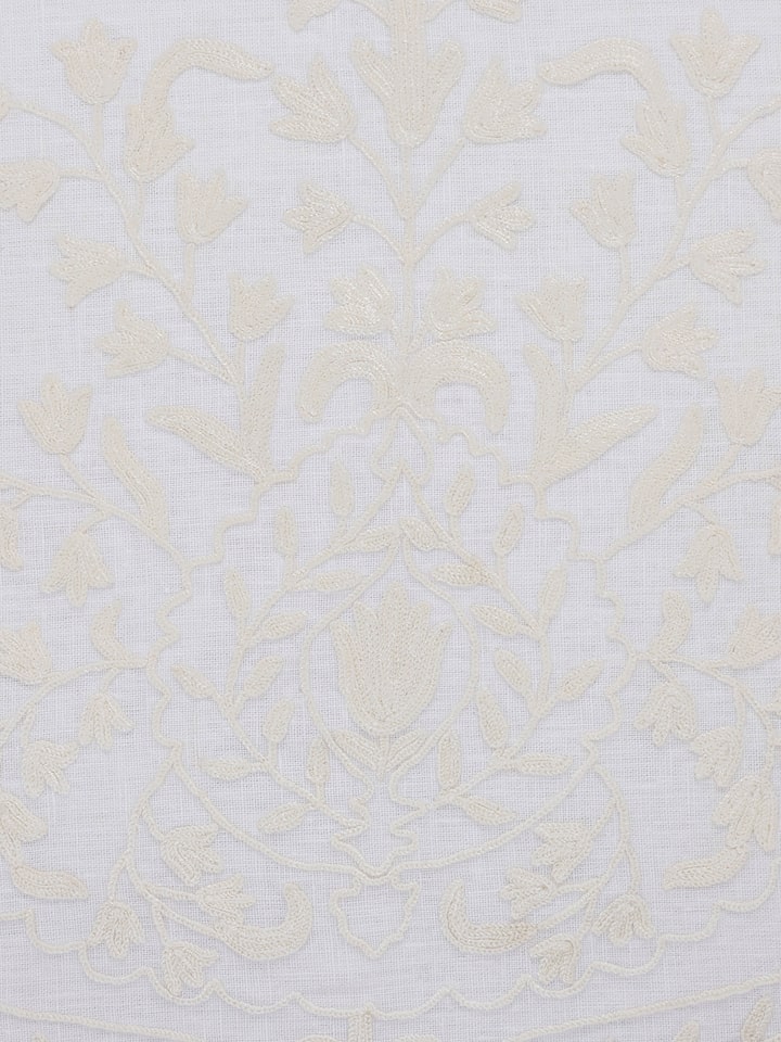 Close-up of Razza ivory carnation buta linen crewel hand-embroidered cushion cover emphasizing the detailed stitching and patterns