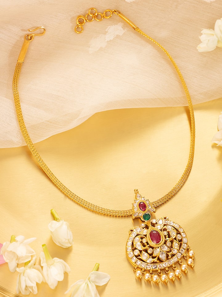 Side angle showing detailed patterns on 22 Karat gold collar necklace