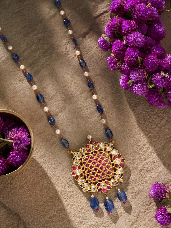 Second lifestyle view of Badroom gold pendant styled with ethnic outfit for a graceful look